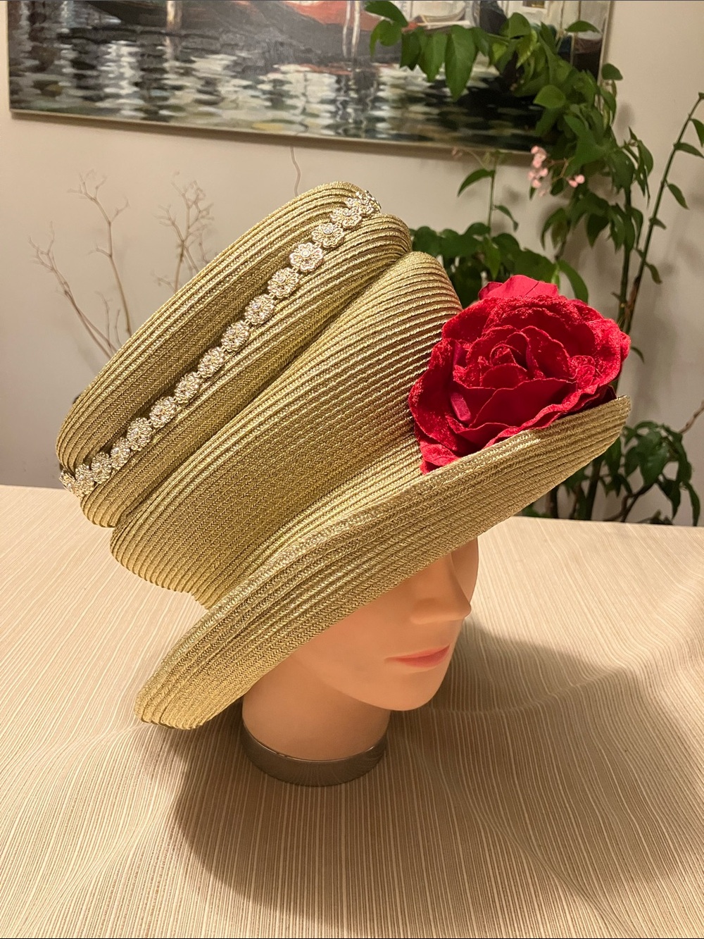 Elegant Gold Metallic Hat with Red Velvet Floral Accent and Gold Rhinestone Band